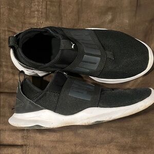 Women’s Black Adidas slip on sneakers